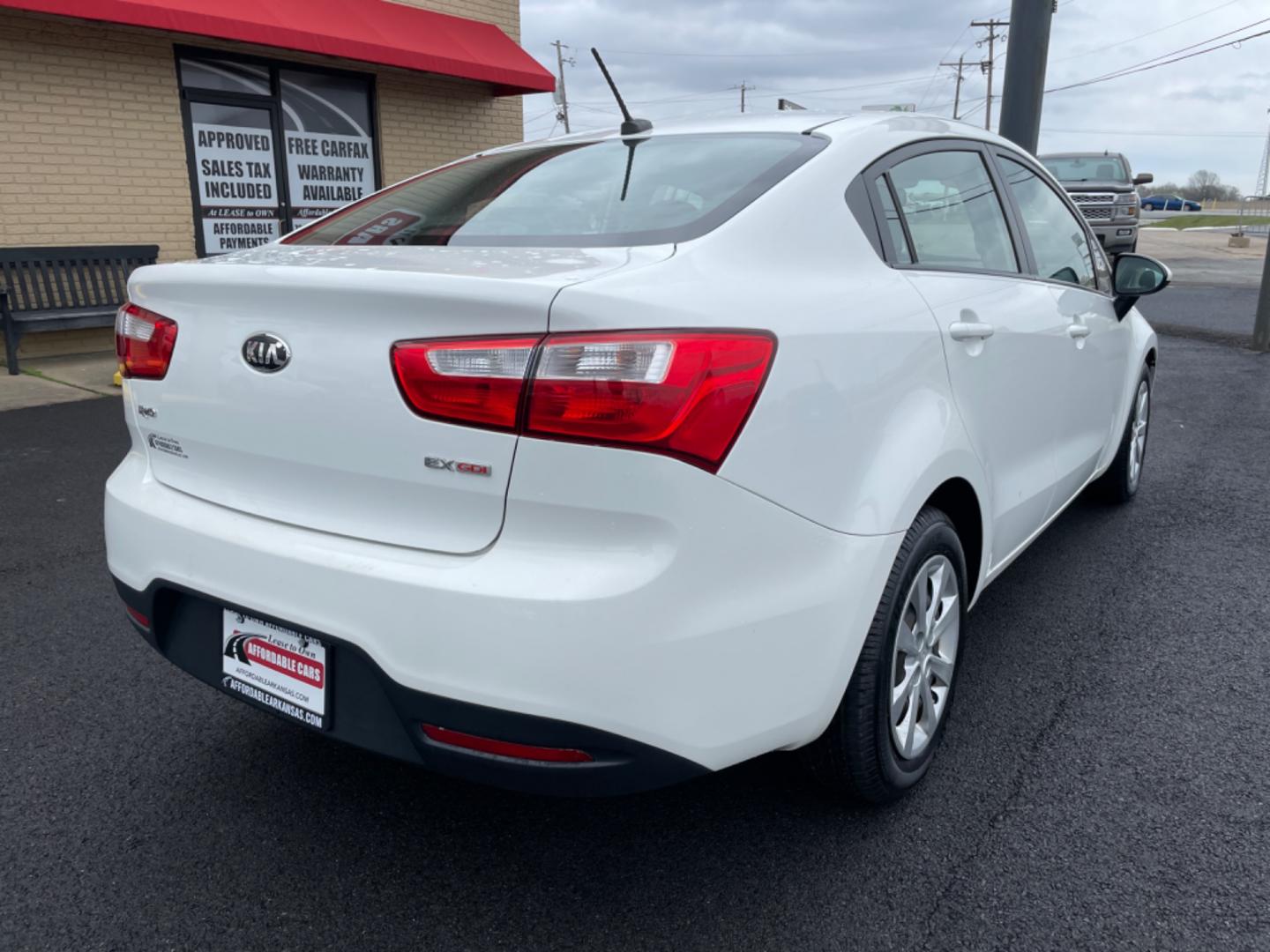 2014 White Kia Rio (KNADN4A35E6) with an 4-Cyl, 1.6 Liter engine, Automatic, 6-Spd transmission, located at 8008 Warden Rd, Sherwood, AR, 72120, (501) 801-6100, 34.830078, -92.186684 - Photo#7